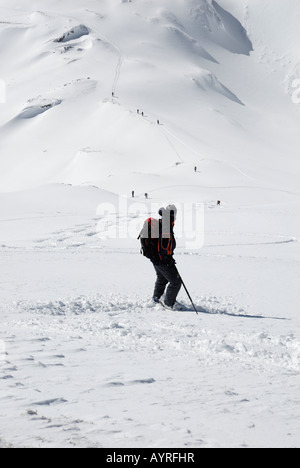 Cross-country skier taking a break in deep snow, Rofan Range, Austrian Alps, Tirol, Austria Stock Photo