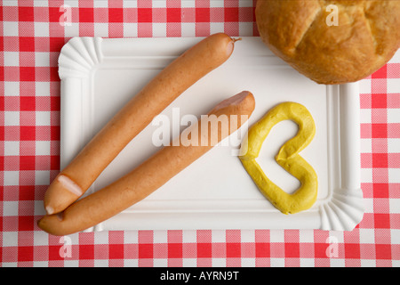 Two wieners with heart-shaped mustard Stock Photo