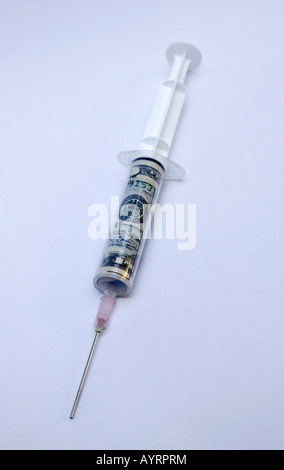 Syringe loaded with US Dollard to inject liquidity in to the economy Stock Photo