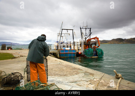 Herring Fisherman at Crinan 18th century harbour and canal on the  western coastline of Scotland. Stock Photo