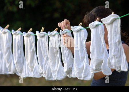 Nappies being hung out to dry on a washing line Stock Photo