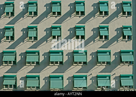 Building facade, shutters on the windows, front view Stock Photo