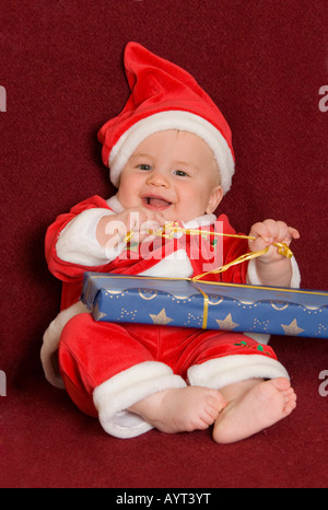 6-month-old little boy wearing Santa Claus costume Stock Photo