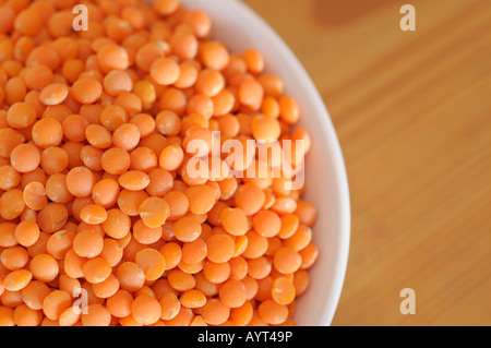 Red lentils (Lens esculenta) in a bowl Stock Photo