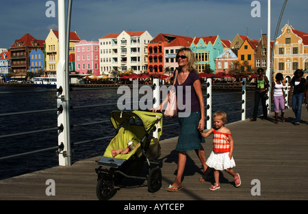 Netherlands Antilles Curacao a mother with buggy and toddler crossing the Emma bridge of Willemstad punda Stock Photo