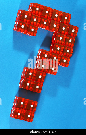 Question mark made out of red dices on blue background Stock Photo