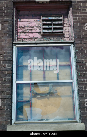 Boarded windows and smashed glass Stock Photo - Alamy