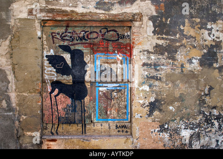Graffiti and texture on an old wall in central Barcelona spain Stock Photo