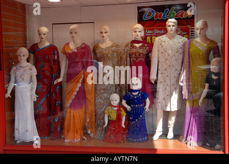 A shop display of saris and Asian style clothes in Luton UK Stock Photo