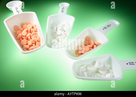 Measuring Spoons with Tablets Stock Photo