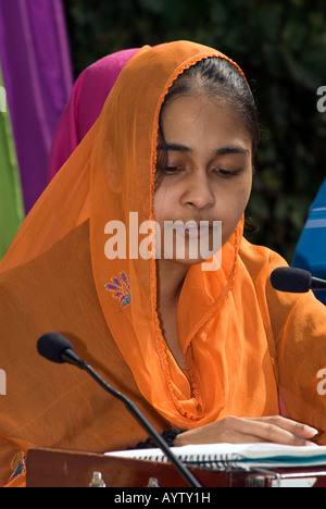 Sikh girl outside gurdwara or temple playing music on the festival of Vaisakhi Sri Guru Singh Sabha Hounslow UK 14 April 2008 Stock Photo