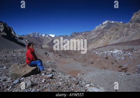 Trekker looking at view in Lower Horcones Valley, Aconcagua Provincial Park, Mendoza province, Argentina Stock Photo