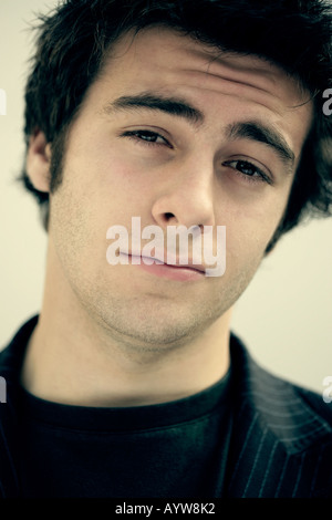 Portrait of a thoughtful young man Stock Photo