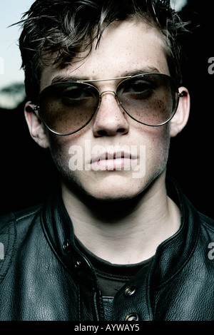 Close up of a rockerbilly posing in sunglasses Stock Photo