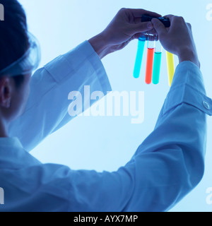 lab reasercher holding test tube Stock Photo