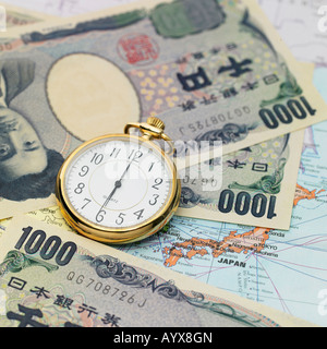 alarm clock on the money and map of Japan Stock Photo