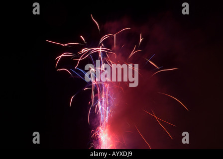 Explosion of Fireworks taken on bonfire night against a dark black night sky Stock Photo