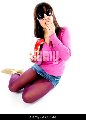 Teenage Girl Eating Crisps Model Released Stock Photo