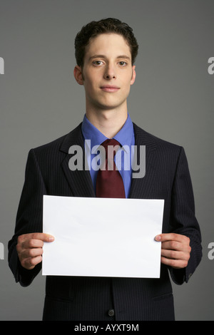 business man holding a paper sign with the word bill written on it ...