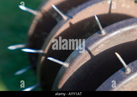Old lawn aerator spiking Stock Photo