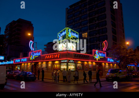 Neon signs entice holidaymakers into the bars and cabaret shows in Benidorm Pictured is Stardust Stock Photo