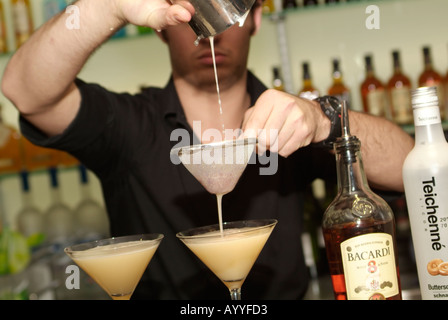 bartender pouring cocktail drink Stock Photo