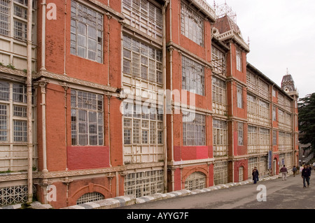 Shimla heritage British era Railway Board Building (1896-97), Himachal Pradesh, India. Historic colonial red brick architecture on a hillside path. Stock Photo