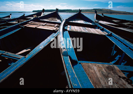 Small boats on the Moulay Bousselham lagoon shore Morocco Stock Photo