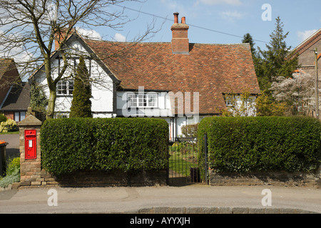 Old house with victorian post box in Toddington village, Bedfordshire Stock Photo