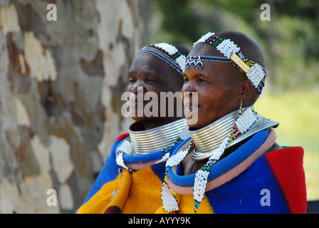 Two Ndebele woman in their traditional clothing in the museum village of Botshabelo in South Africa near Middelburg. Stock Photo