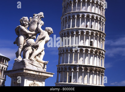 Cupid statue and Leaning Tower of Pisa Piazza del Duomo Campo dei Miracoli Pisa Tuscany Italy Stock Photo