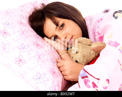 Young Fragile Teenage Woman Or Girl Holding A Comfort Teddy Bear To Feel More Secure In Life Stock Photo