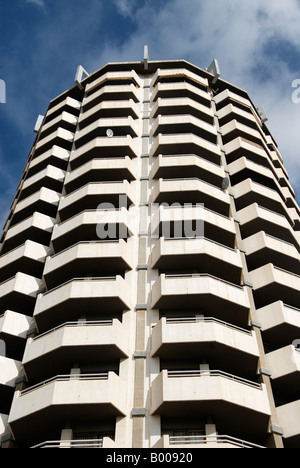 satellite dish on the balcony of a fortresslike residential skyscraper Stock Photo