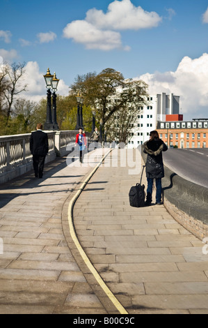 pedestrians in kingston, surrey, england, use a road crossing with ...