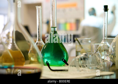 Various glass beakers in scientific chemistry laboratory. Stock Photo