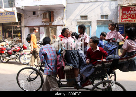 Girls travelling to school in a cycle rickshaw in India Stock Photo ...