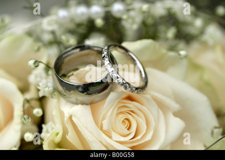 Wedding rings on bouquet Stock Photo