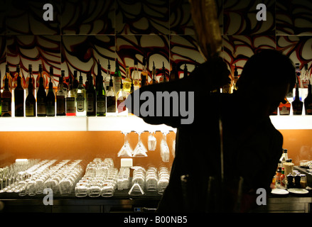 Bar tender pouring a drink Stock Photo