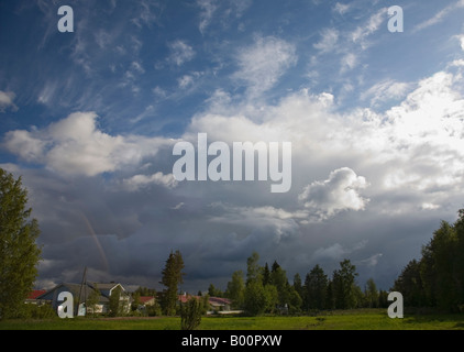 Weather front, edge of the thunderstorm clouds rising over Finnish residential area , Finland Stock Photo
