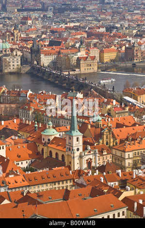 An aerial view of the Charles Bridge in Prague and surrounding area taken from the tower on top of Saint Vitus's Cathedral. Stock Photo