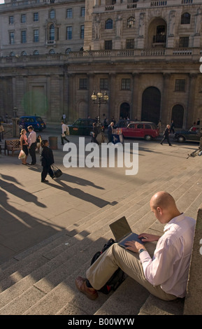 Man using Laptop Computer, City of London Stock Photo