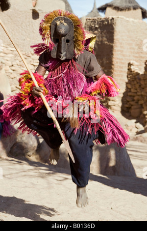 Mali, Dogon Country, Tereli. A masked dancer leaps high in the air at the Dogon village of Tereli. Stock Photo