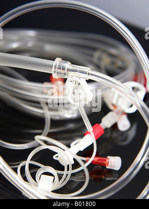 Close up of intravenous tubes with valve Stock Photo
