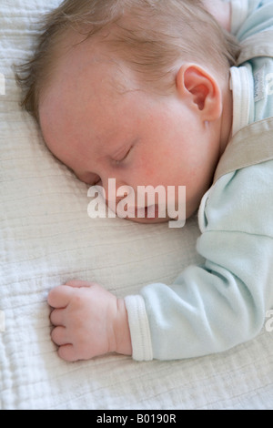 Baby sleeping on his belly Stock Photo