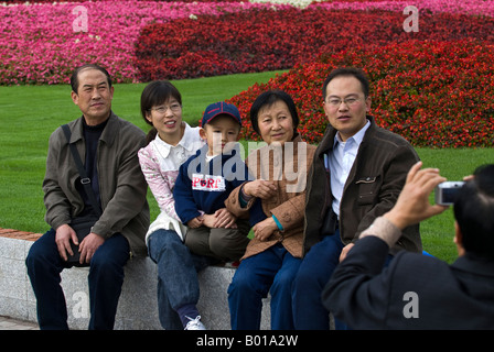 Child, parents and grandparents photographed during outing, Renmin Park, Shanghai, China Stock Photo