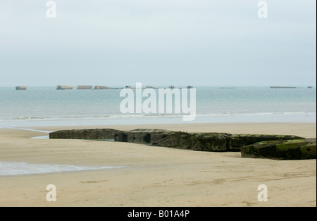 Mulberry harbour section on the beach at Arromanches, Normandy, left over form the D-Day landings Stock Photo