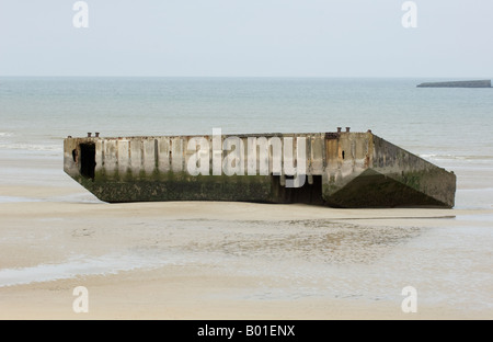 Mulberry harbour section on the beach at Arromanches, Normandy, left over form the D-Day landings Stock Photo