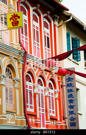 windows with shutters on second story apartment in Singapore Stock Photo