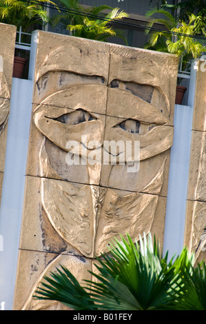 Alien face carved on stone stella Stock Photo