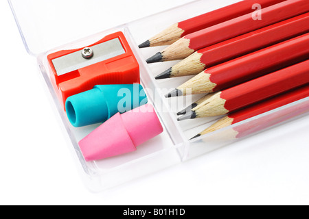 Pencils sharpener and erasers in plastic box on white background Stock Photo